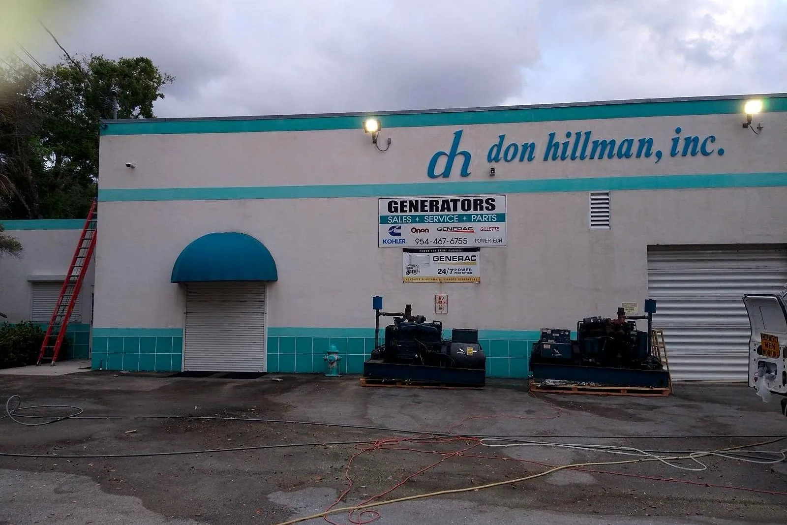 A generator dealership's storefront before and after pressure washing — after