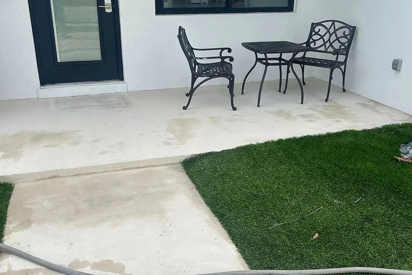 A front porch and walkway before and after cleaning — after